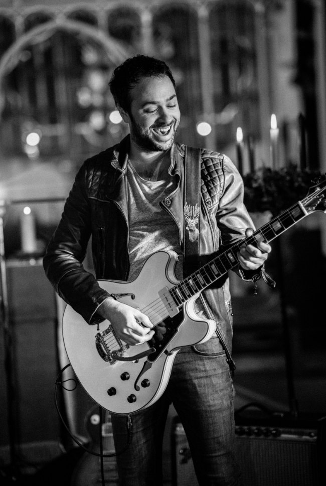 Guitarist playing at an evening reception