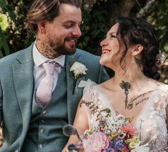 Couple laughing in a garden