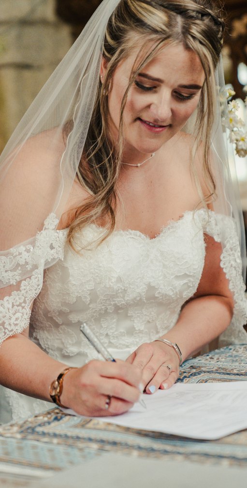 Bride signing the register